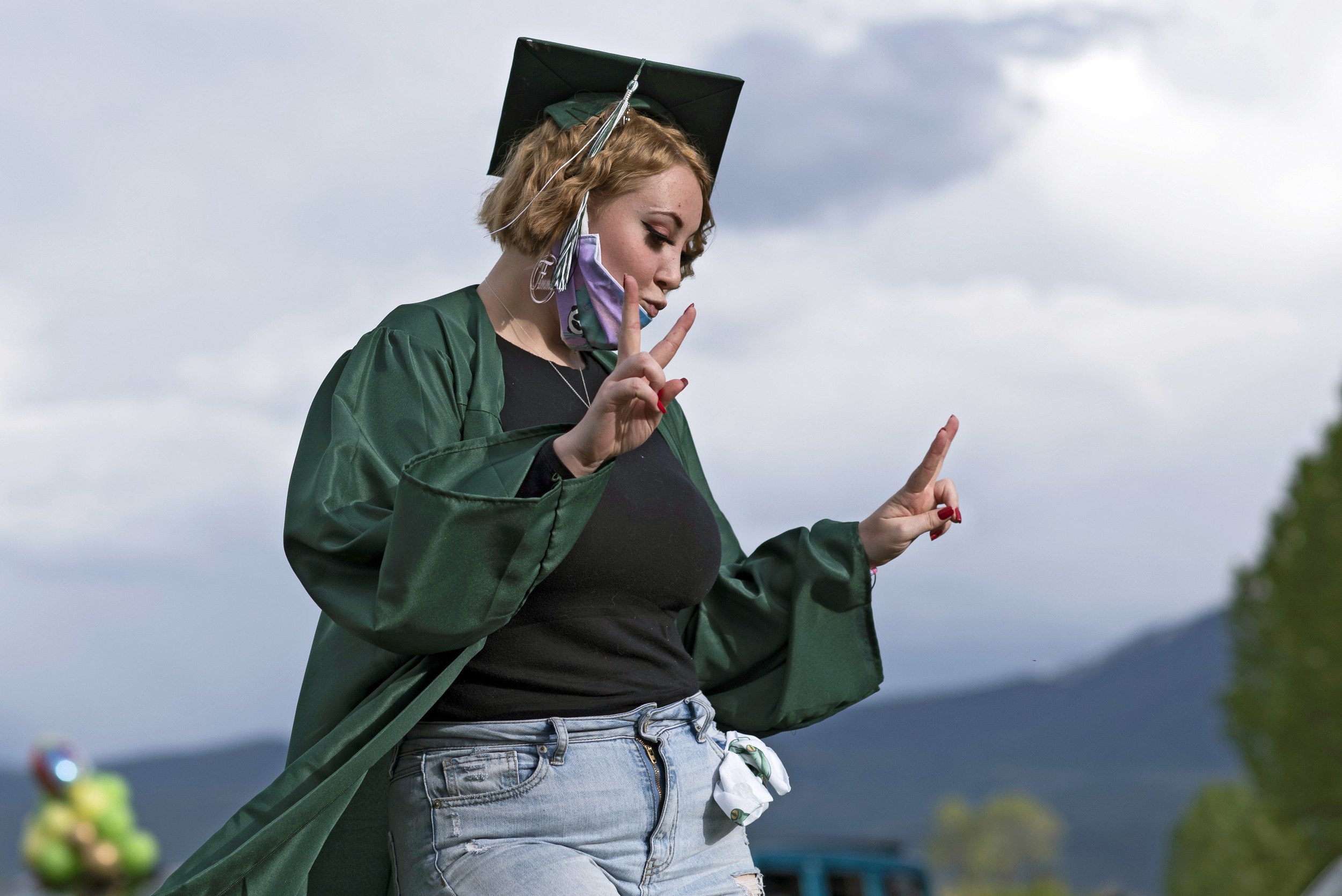 Roaring Fork and Bridges High School graduates drove rather than walked into adulthood. With KDNK broadcasting the ceremonies, they stepped out of their cars to turn their tassels and then paraded through downtown. Photo by Laurel Smith