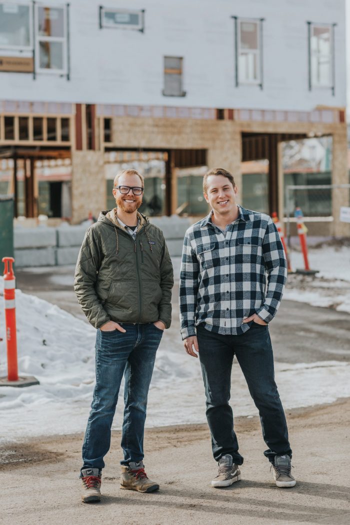 Mark Hardin (left) and David Eisenson (right) stand on Colorado Avenue in front of the partially-constructed building that will house their deli, Plosky’s, which will feature bagels and lox, reubens, pastrami on rye and other classic New York sandwich fare. Photo by Olivia Emmer.